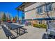 Exterior view of condos with community picnic tables, grill and bicycle storage at 214 N Main St # 14, Breckenridge, CO 80424