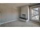 Living room with a fireplace, carpet and sliding glass door for natural light and access at 214 N Main St # 14, Breckenridge, CO 80424