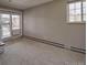 Living room with a sliding glass door, window and carpet at 214 N Main St # 14, Breckenridge, CO 80424
