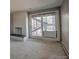 The living room has a fireplace and sliding glass doors leading to an outdoor staircase at 214 N Main St # 14, Breckenridge, CO 80424