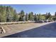 Convenient parking lot with ample spaces and a serene view of the surrounding trees and neighborhood at 214 N Main St # 14, Breckenridge, CO 80424