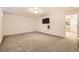 Finished basement area offers flexible space for recreation and entertainment, complete with mounted television at 2777 E Geddes Ave, Centennial, CO 80122