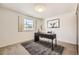 Bedroom with a modern desk, grey rug and a window with shutters at 2777 E Geddes Ave, Centennial, CO 80122