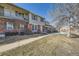 Townhome exteriors with brick accents and gray siding, showcasing the neighborhood at 2777 E Geddes Ave, Centennial, CO 80122