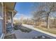 View of a green common area from the front porch sitting area at 2777 E Geddes Ave, Centennial, CO 80122