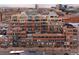 High-angle view features the expansive brick apartment complex with many balconies, offering urban living at 1499 Blake St # 6A, Denver, CO 80202