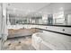 Bathroom with double sinks, large mirror, and a soaking tub, providing a spa-like atmosphere at 1499 Blake St # 6A, Denver, CO 80202