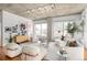 Contemporary living room with unique furniture, hardwood floors and concrete ceilings at 1499 Blake St # 6A, Denver, CO 80202