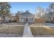 Charming single-Gathering home with an inviting exterior, tidy yard and walkway to the front entrance at 722 Kimbark St, Longmont, CO 80501