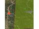 An aerial view shows the property boundaries in a forested area with the City & County of Denver in the background at 8724 Armadillo Trl, Evergreen, CO 80439