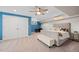 Spacious bedroom with a ceiling fan, recessed lighting, and neutral carpeting at 8724 Armadillo Trl, Evergreen, CO 80439