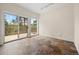 Spacious bedroom with tile floors, access to a private balcony with scenic views and lots of natural light at 8724 Armadillo Trl, Evergreen, CO 80439