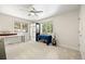 Light-filled bedroom with two large windows and ceiling fan at 8724 Armadillo Trl, Evergreen, CO 80439