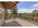 Outdoor deck offering scenic views of the surrounding mountains and trees at 8724 Armadillo Trl, Evergreen, CO 80439