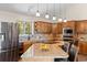 This spacious kitchen features granite countertops and stainless steel appliances at 8724 Armadillo Trl, Evergreen, CO 80439