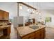 The kitchen features granite countertops, a center island, and an open floor plan at 8724 Armadillo Trl, Evergreen, CO 80439