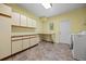 Laundry room with cabinets, counter space, and front-load washer and dryer at 8724 Armadillo Trl, Evergreen, CO 80439
