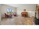 Bright living room featuring piano, purple furniture, and mountain views at 8724 Armadillo Trl, Evergreen, CO 80439