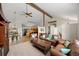 Open concept living space with views of the kitchen and eat in area at 8724 Armadillo Trl, Evergreen, CO 80439