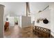 Open-concept living area with tiled floors, views, and decorative hat rack at 8724 Armadillo Trl, Evergreen, CO 80439