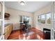 Home office with hardwood floors, built-in cabinets, and scenic outdoor views at 8724 Armadillo Trl, Evergreen, CO 80439