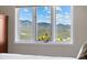 Bedroom window with expansive mountain views at 8724 Armadillo Trl, Evergreen, CO 80439