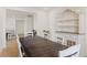 Dining room with a dark wood table, chairs, and a white hutch at 15740 Spruce St, Thornton, CO 80602