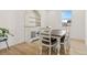 Bright dining room features a wood table with chairs and a hutch at 15740 Spruce St, Thornton, CO 80602