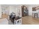 Living room with hardwood floors and a view into the kitchen at 15740 Spruce St, Thornton, CO 80602