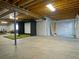 Spacious unfinished basement area, framed and ready for customization with a golf simulator at 609 Pioneer Camp Vw, Palmer Lake, CO 80133