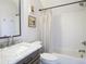 Bathroom with a marble vanity, a toilet, and a shower with a white shower curtain at 609 Pioneer Camp Vw, Palmer Lake, CO 80133