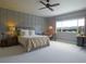 Spacious bedroom with gray walls, large window view, and a comfortable king-sized bed at 609 Pioneer Camp Vw, Palmer Lake, CO 80133