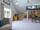 Bonus room featuring neutral carpet, an office space, and a unique sleeping loft accessible by ladder at 609 Pioneer Camp Vw, Palmer Lake, CO 80133
