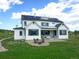Beautiful exterior view of this modern farmhouse with a spacious backyard with solar panels at 609 Pioneer Camp Vw, Palmer Lake, CO 80133