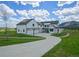 Stately home featuring a long driveway, three-car garage, and mountain views at 609 Pioneer Camp Vw, Palmer Lake, CO 80133