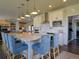Stylish kitchen with island seating, stainless steel appliances, white cabinets, and ample counter space at 609 Pioneer Camp Vw, Palmer Lake, CO 80133