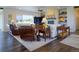 Spacious living room featuring a fireplace, open layout, and ample natural light at 609 Pioneer Camp Vw, Palmer Lake, CO 80133