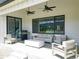 Outdoor patio features comfortable seating and an outdoor ceiling fan, perfect for enjoying the weather at 609 Pioneer Camp Vw, Palmer Lake, CO 80133