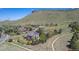 Aerial view of neighborhood with mature landscaping and mountain backdrop at 19096 W 53Rd Pl, Golden, CO 80403
