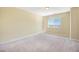 Bright, carpeted bedroom with a window offering natural light, providing a comfortable and inviting atmosphere at 19096 W 53Rd Pl, Golden, CO 80403