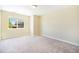 Bright, carpeted bedroom with a window offering natural light, providing a comfortable and inviting atmosphere at 19096 W 53Rd Pl, Golden, CO 80403
