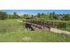 Iron bridge over creek in a verdant and well maintained community at 19096 W 53Rd Pl, Golden, CO 80403