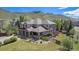 Stately home with mature trees, landscaped yard, and mountain views at 19096 W 53Rd Pl, Golden, CO 80403