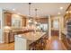 Kitchen with wooden cabinets, stainless appliances, granite counters, and a large center island at 19096 W 53Rd Pl, Golden, CO 80403