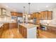 Spacious kitchen with hardwood floors, stainless steel appliances, granite countertops, an island, and ample cabinet space at 19096 W 53Rd Pl, Golden, CO 80403