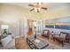 Living room features vaulted ceiling, modern decor, and french doors to other rooms at 19096 W 53Rd Pl, Golden, CO 80403