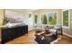 Bright sitting area with large windows, comfortable seating, and stylish decor offering a relaxing space with natural light at 19096 W 53Rd Pl, Golden, CO 80403