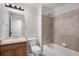 Well-lit bathroom with a single sink, a tub with tile surround, and a functional layout at 12710 Jasmine St # C, Thornton, CO 80602