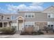 Inviting townhome exterior with stone details, neutral siding, and a well-maintained entrance in a friendly neighborhood at 12710 Jasmine St # C, Thornton, CO 80602