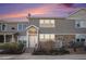 Charming townhome featuring stone accents and a welcoming front entrance at 12710 Jasmine St # C, Thornton, CO 80602